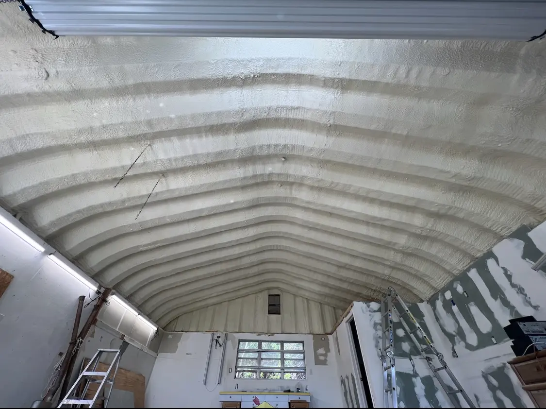 Spray polyurethane foam applied to the underside of a metal roof deck in Ladue